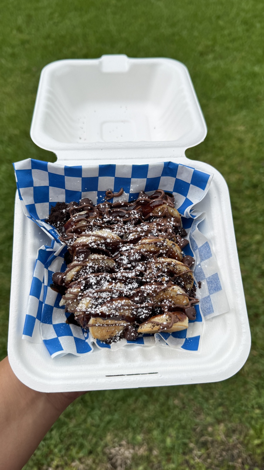 Mini pancakes with banana and chocolate drizzle